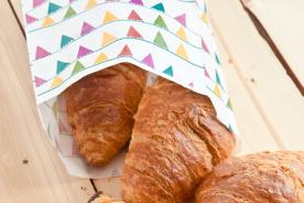 Sweet pastries in a greaseproof paper bag