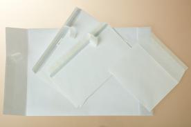 Envelopes and pockets with a silicone paper strip